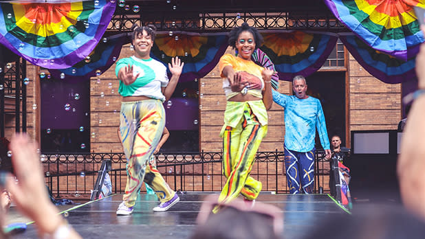 Two people dance on stage at Southern Finger Lakes Pride