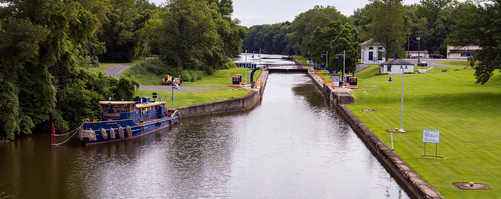 A tugboat floats along the Erie Canal near Lock 25 in Seneca Falls