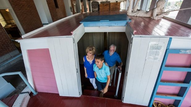 Kid and grandparents on boat at Erie Canal Museum, Syracuse