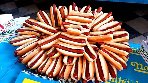 Dozens of Nathan's Famous hot dogs arranged on a platter ahead of the famed eating contest in Coney Island