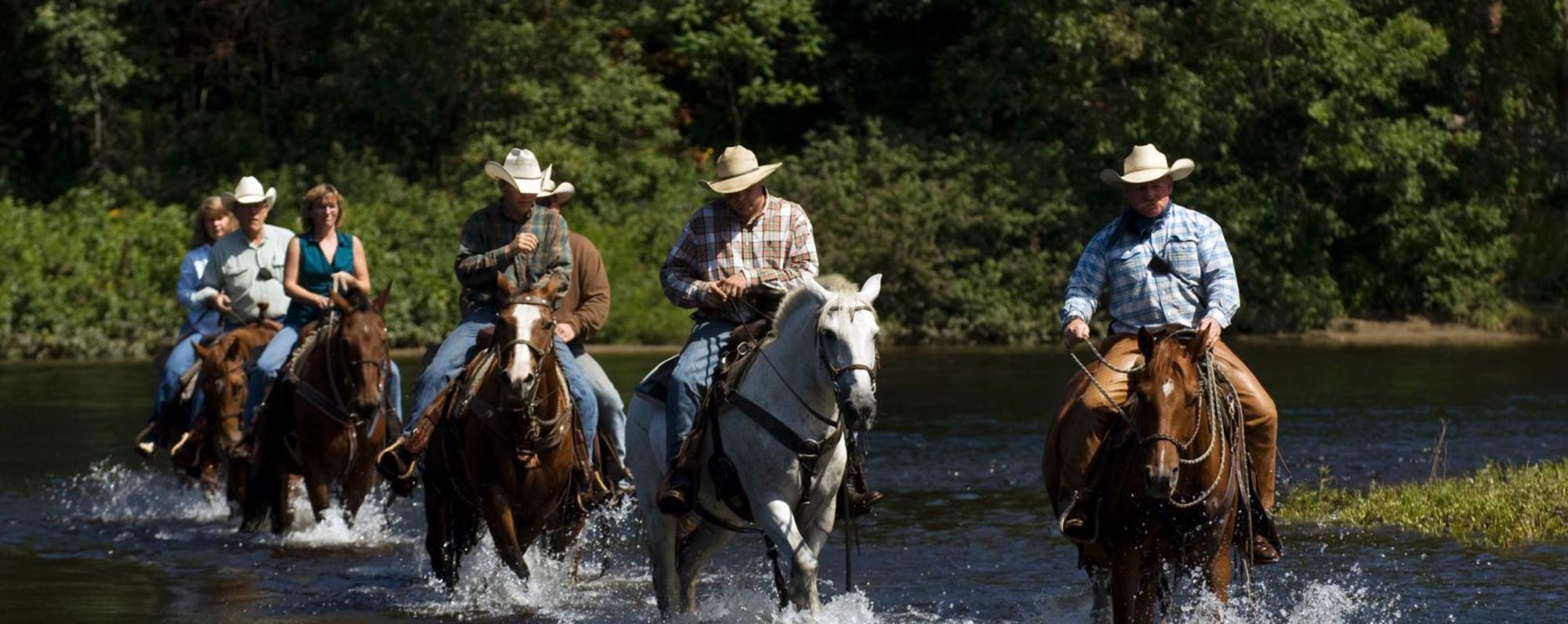 Trail ride through pond at 1000 Acres Ranch (formerly Stony Creek Ranch Resort)