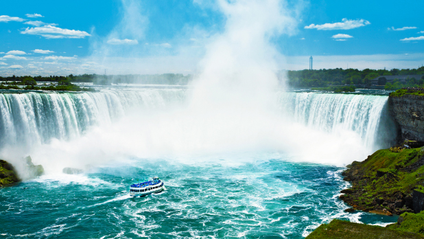 Maid of the Mist on the water beneath Niagara Falls, NY