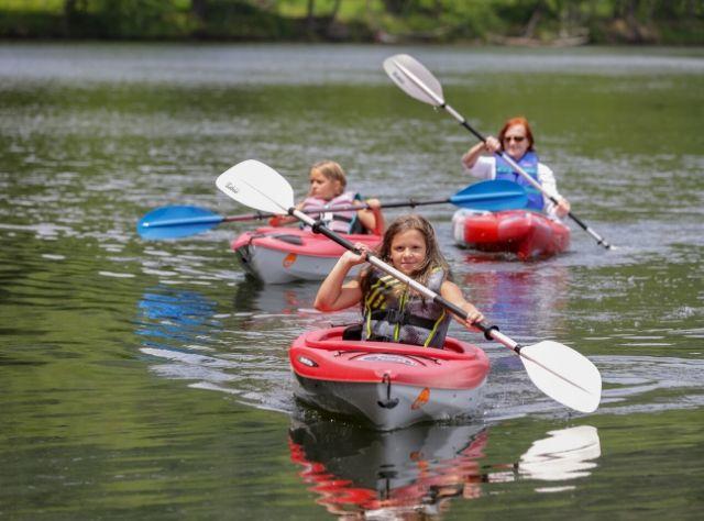 A photo of two girls and their mom kayaking at Mongaup Pond Campground