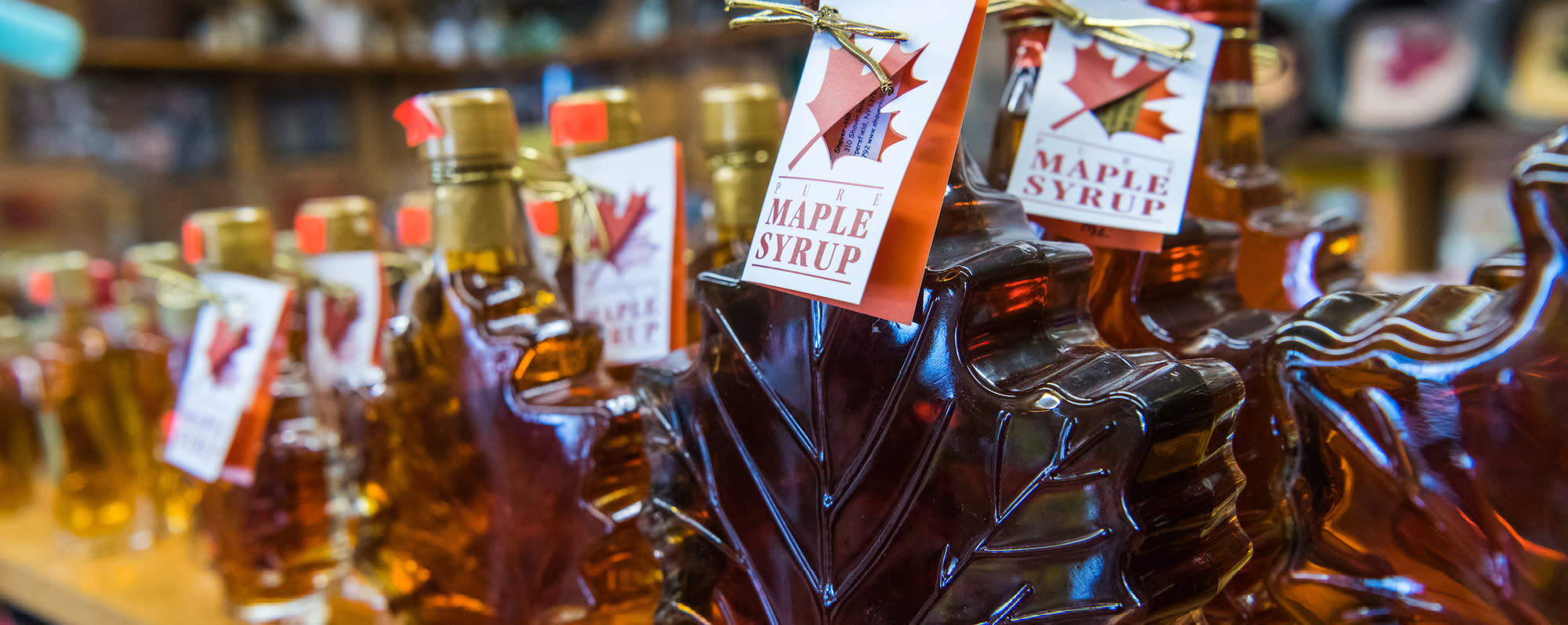 A photo of maple leaf shaped maple bottles at Shaver Hill Maple Farm