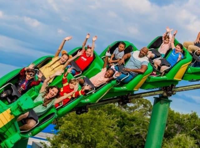 People riding a dragon rollercoaster at Legoland