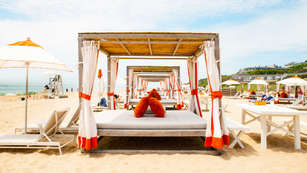 A photo of cabanas on the beach in the Hamptons